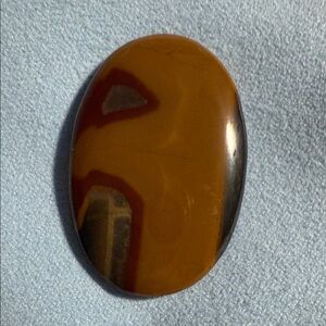 Oval Brown and Red Stone Cabochon